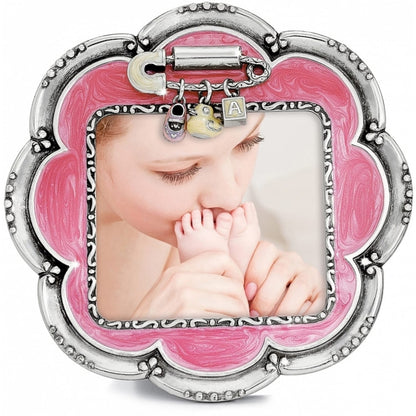 Brighton scalloped picture frame with pink enamel, silver-tone beaded border, and baby charms on a white background