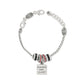 Brighton silver-plated charm bracelet with black and red crystal beads and Teachers Have Class charm on a white background
