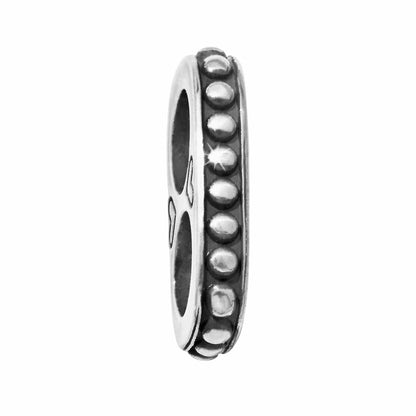 Brighton spacer charm shown from the side with silver-plated beaded edge and openwork detail on a white background