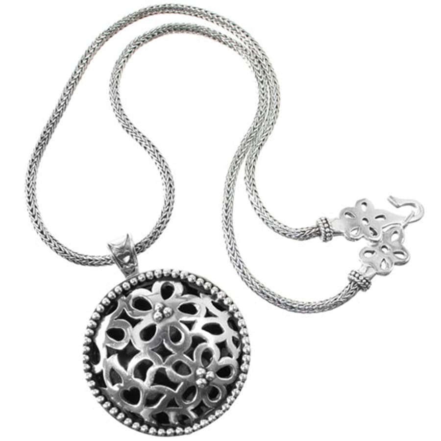 Brighton pendant necklace with sterling silver openwork floral medallion and woven chain on a white background