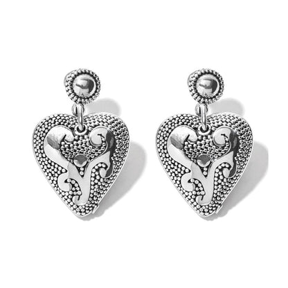 Brighton drop earrings with sterling silver heart charms featuring beaded texture and scroll detailing on a white background