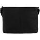 Brighton black leather handbag shown from the back with pebbled texture and adjustable strap on a white background