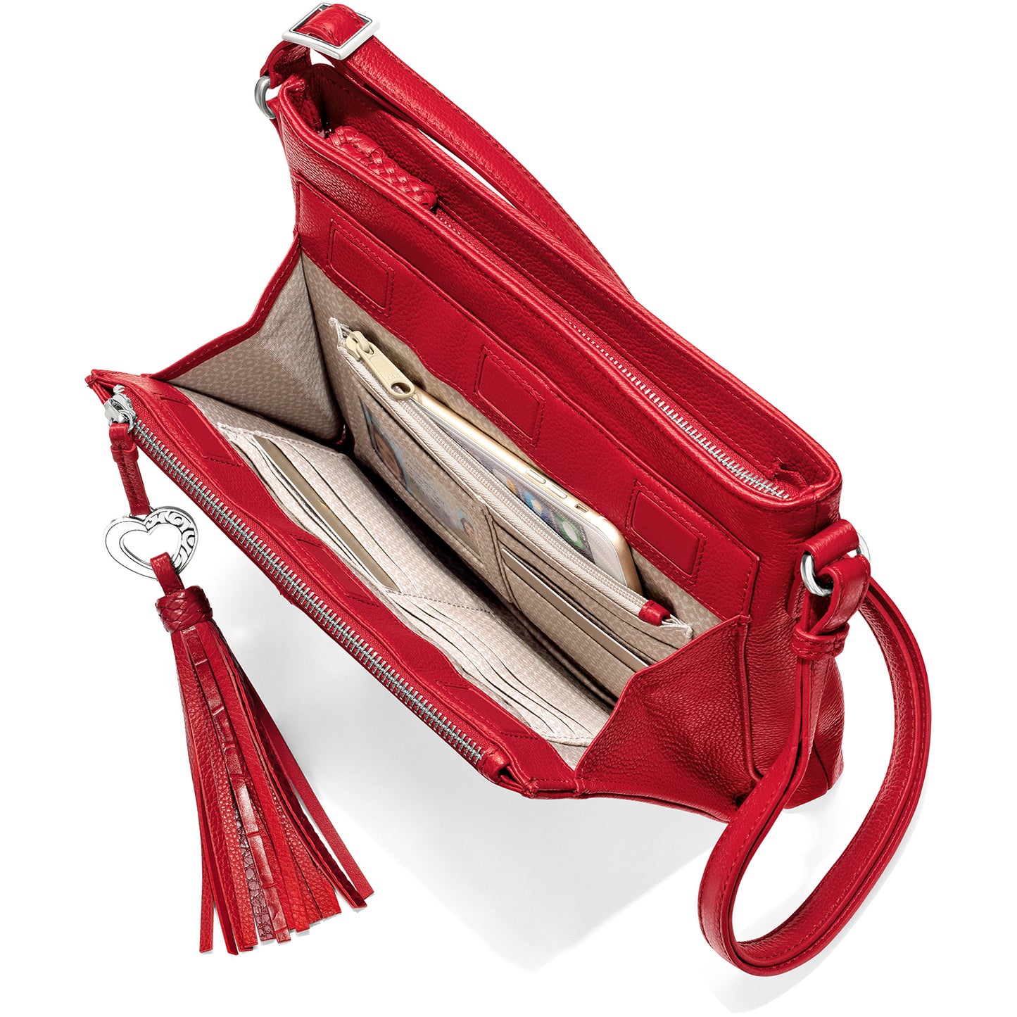Brighton red leather handbag shown open with interior card slots, zip pocket, phone, and tassel pull on a white background