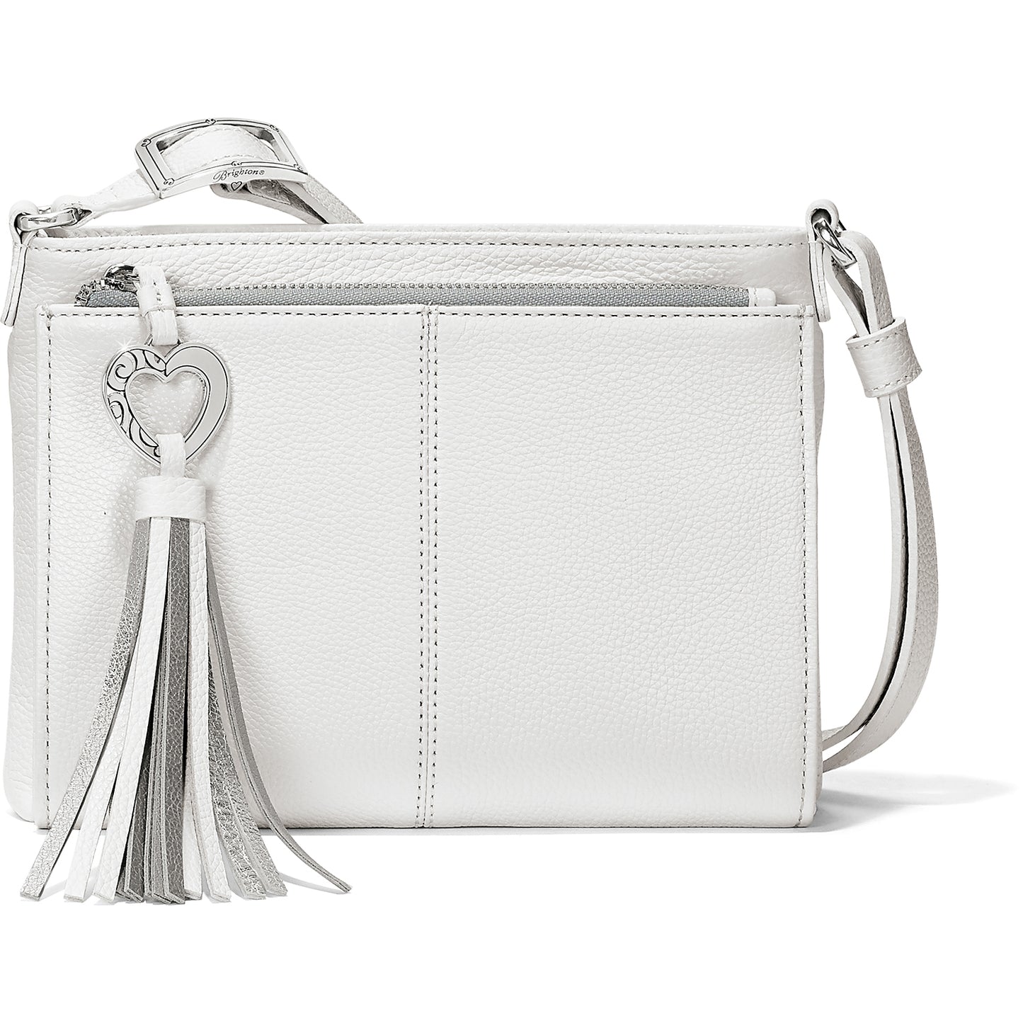 Brighton crossbody handbag in white pebbled leather with silver-tone heart charm and metallic tassel on a white background