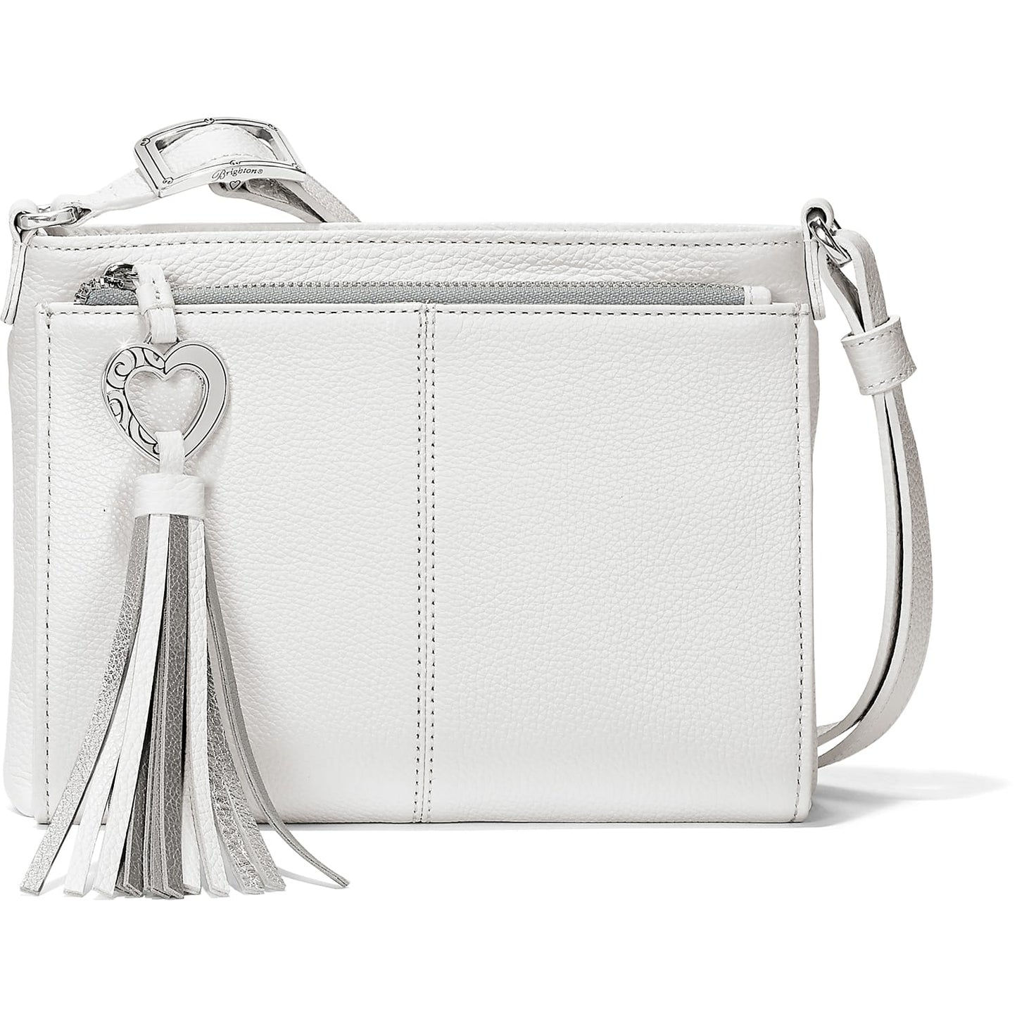 Brighton crossbody handbag in white pebbled leather with silver-tone heart charm and metallic tassel on a white background