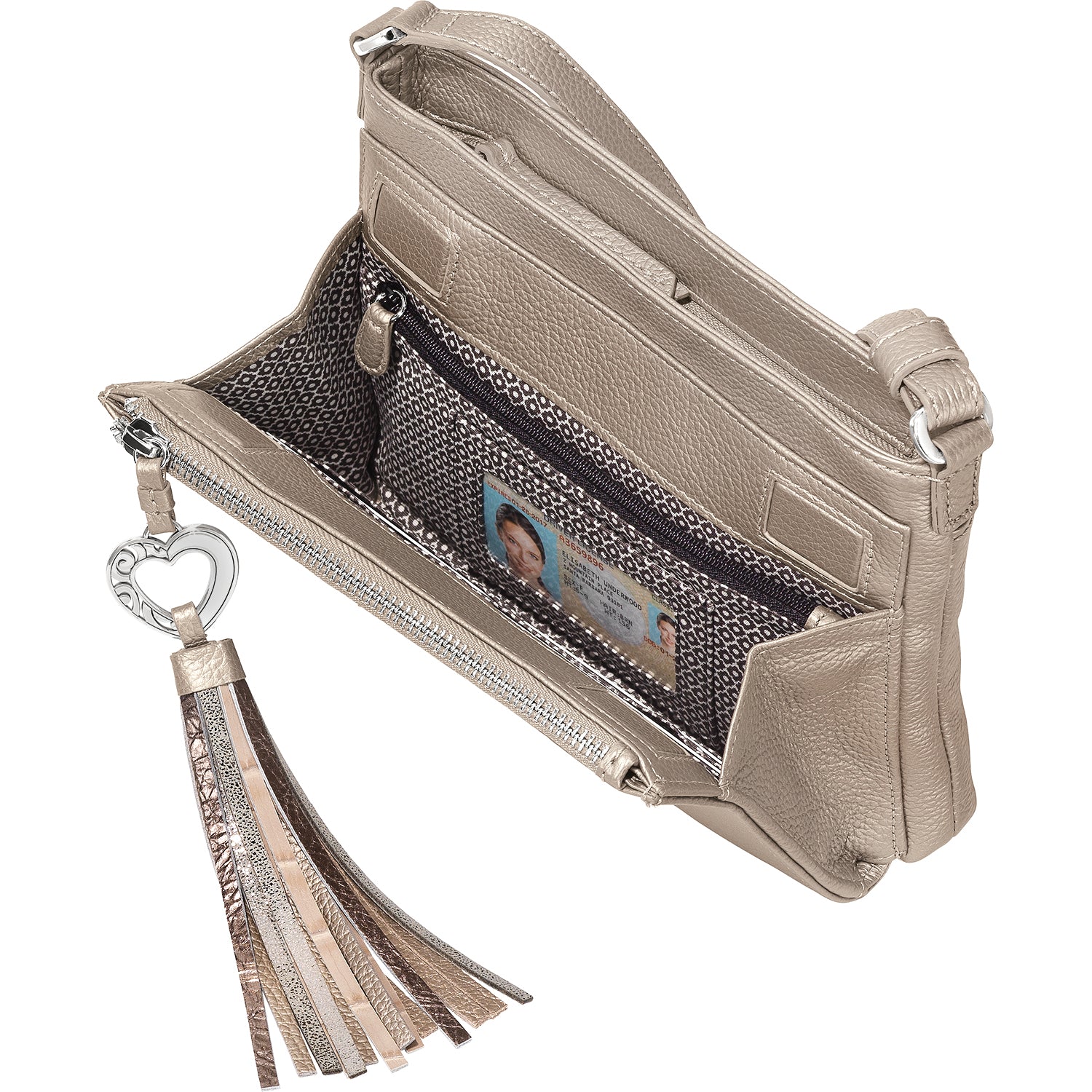 Brighton handbag shown open with metallic gold leather, patterned interior, ID window, and tassel charm on a white background