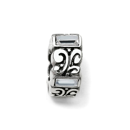 Brighton silver-plated spacer charm with scroll filigree design and clear crystal baguette accents on a white background