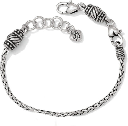 Brighton braided chain bracelet with silver-plated ornate beaded caps, lobster clasp, and heart charm on a white background