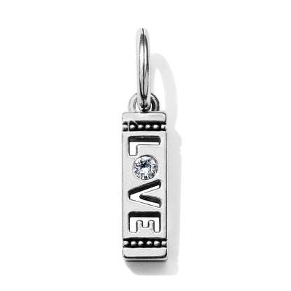Brighton silver-plated charm with cutout LOVE lettering, crystal accent, and beaded borders on a white background