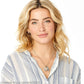 Model wearing a Brighton silver-plated pendant necklace with heart photo charm and love charm paired with hoop earrings