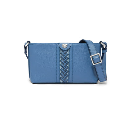 Brighton blue leather crossbody handbag with braided center detail and adjustable silver-tone buckle strap on a white background