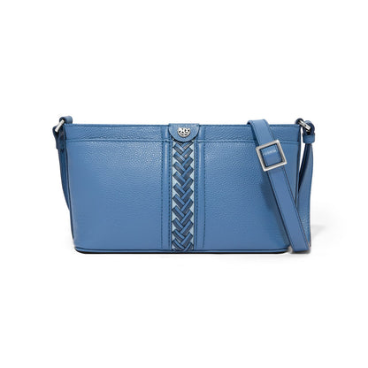 Brighton blue leather crossbody handbag with braided center detail, silver-tone medallion, and adjustable strap on a white background
