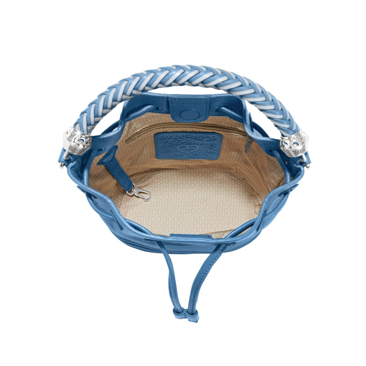 Brighton blue leather bucket handbag interior view with patterned fabric lining, zip pocket, and braided handle on a white background