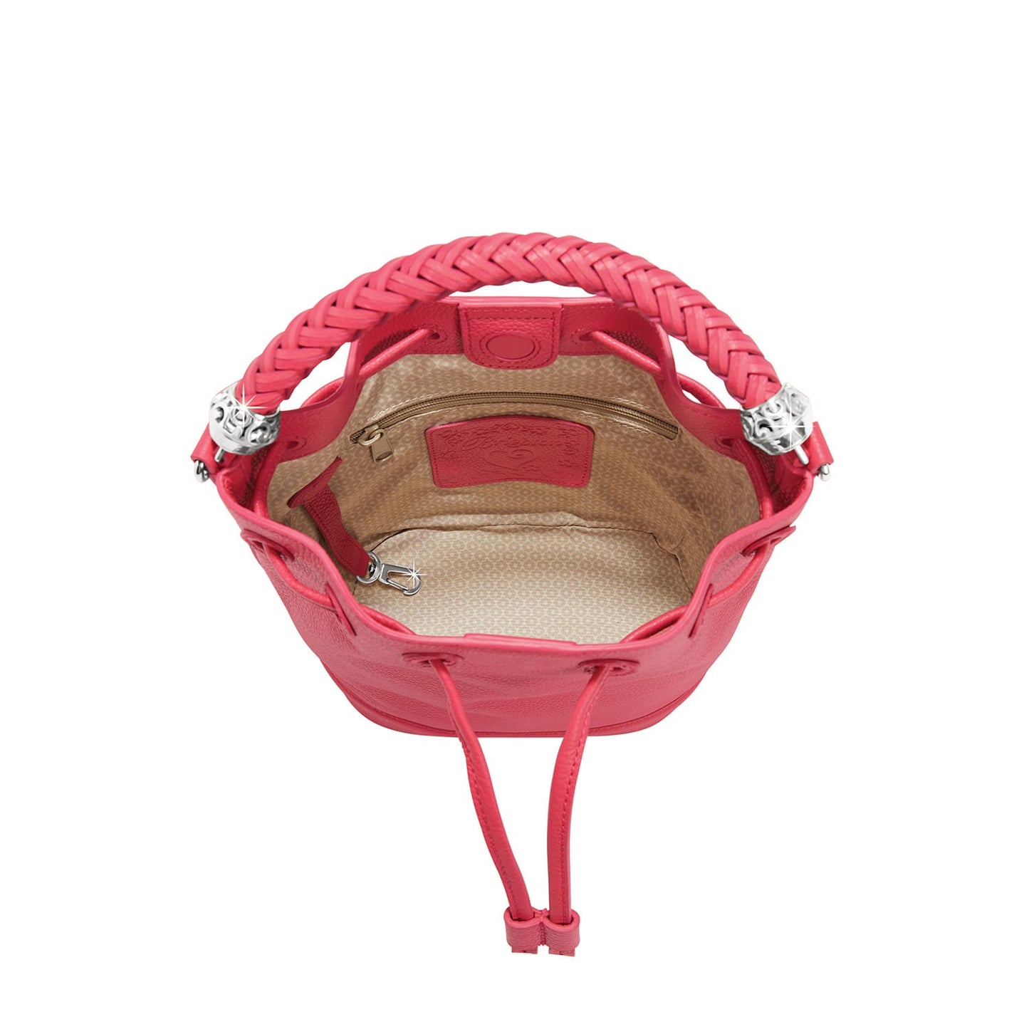 Brighton pink leather bucket handbag shown from above with braided handle, drawstring closure, and patterned interior lining on a white background
