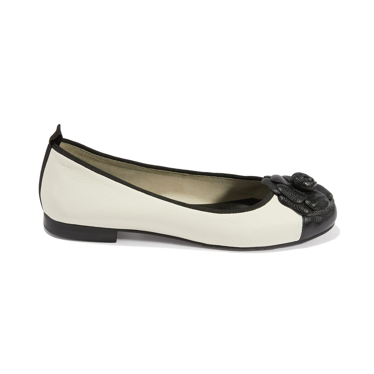 Brighton ballet flats in white leather with black cap toe, floral appliqué, and trim on a white background