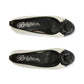 Brighton ballet flats in cream leather with black rosette toe caps and black trim on a white background