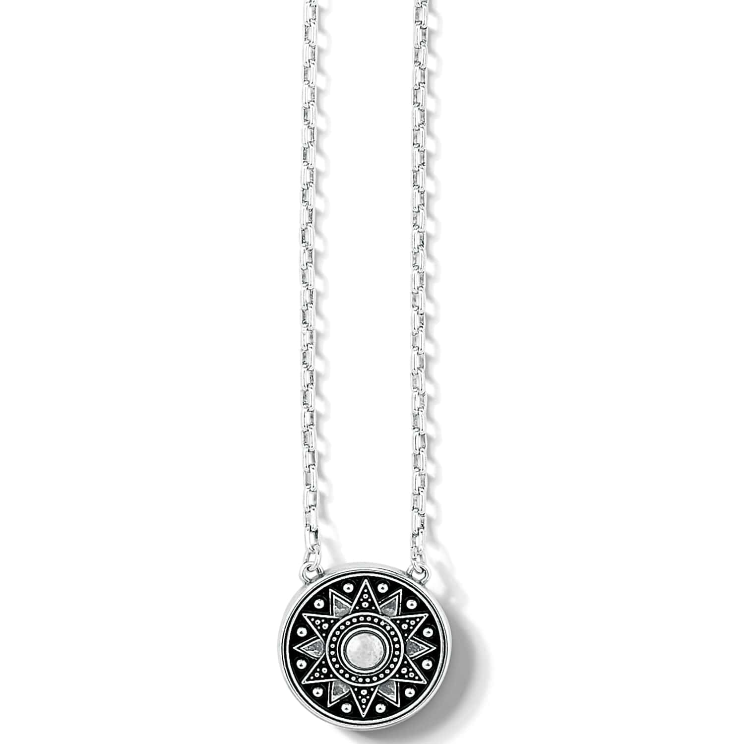 Brighton pendant necklace with silver-plated round medallion featuring star motif and crystal center on a white background