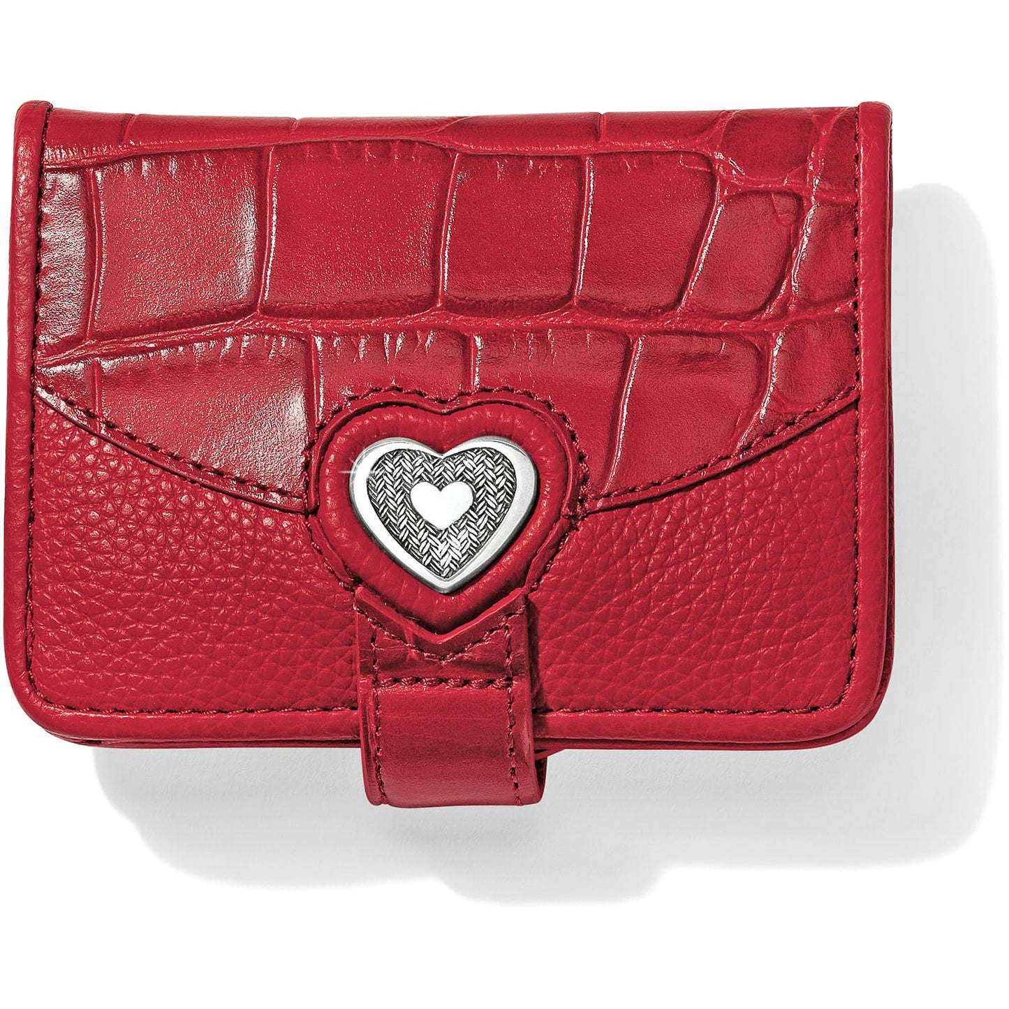 Brighton small wallet in red croc-embossed and pebbled leather with silver-tone heart medallion closure on a white background