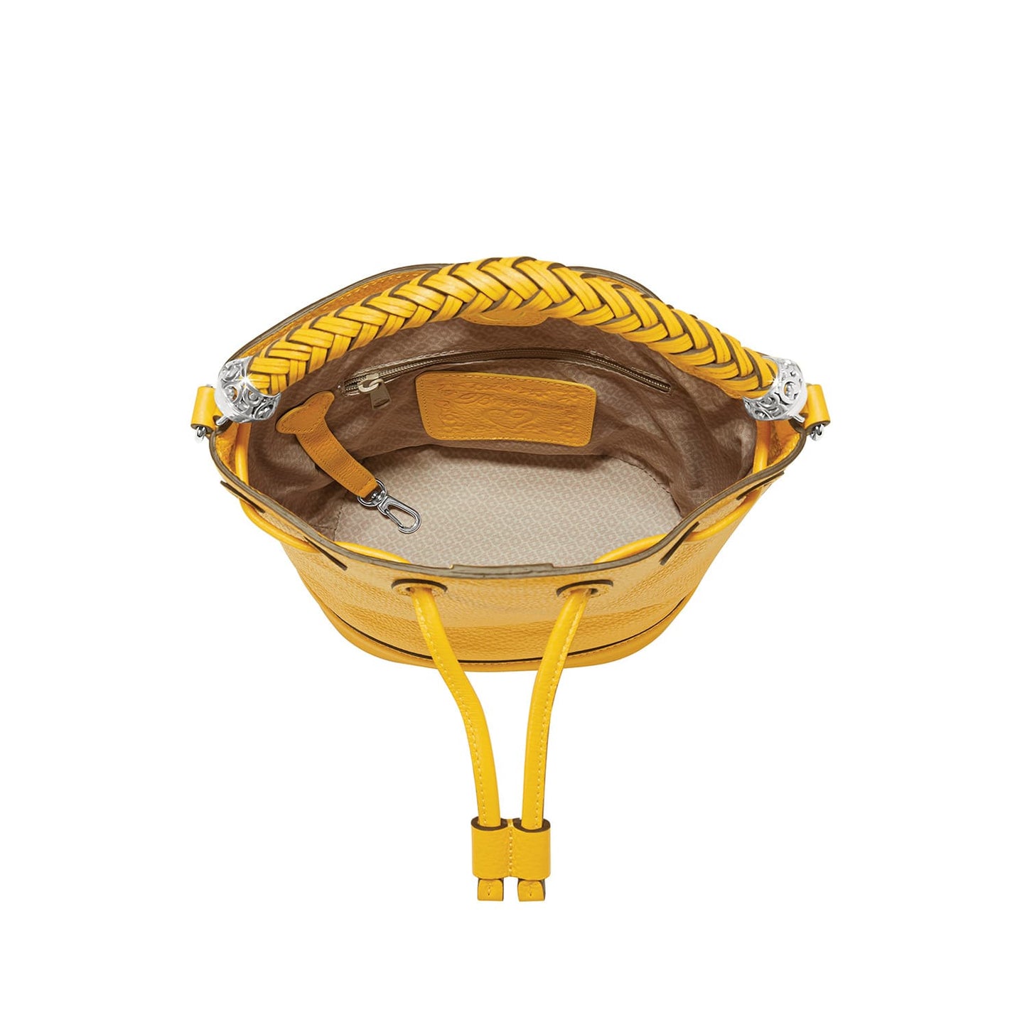 Brighton yellow leather bucket handbag interior view with braided trim, zip pocket, and silver-tone accents on a white background