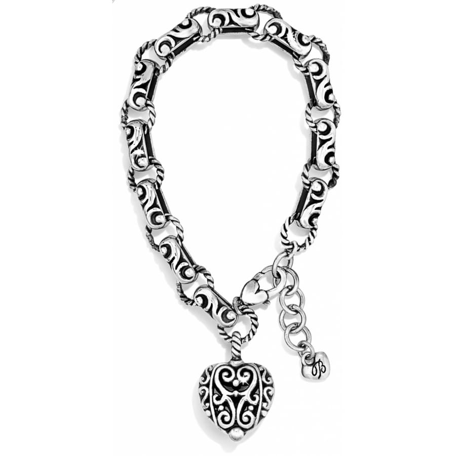 Brighton charm bracelet with silver-plated ornate scroll links and heart charm with filigree detail on a white background