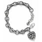 Brighton charm bracelet with silver-plated scrollwork links, ornate heart charm, and lobster clasp on a white background