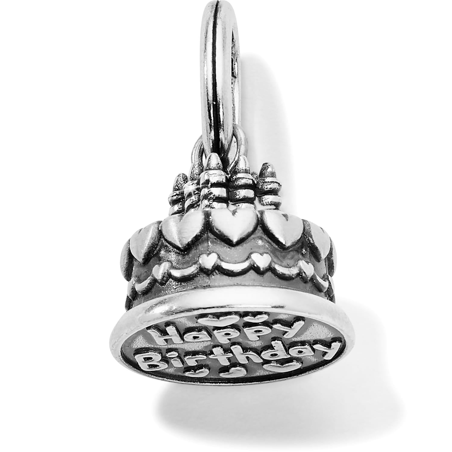 Brighton birthday cake charm with silver-plated heart details and Happy Birthday engraving on a white background