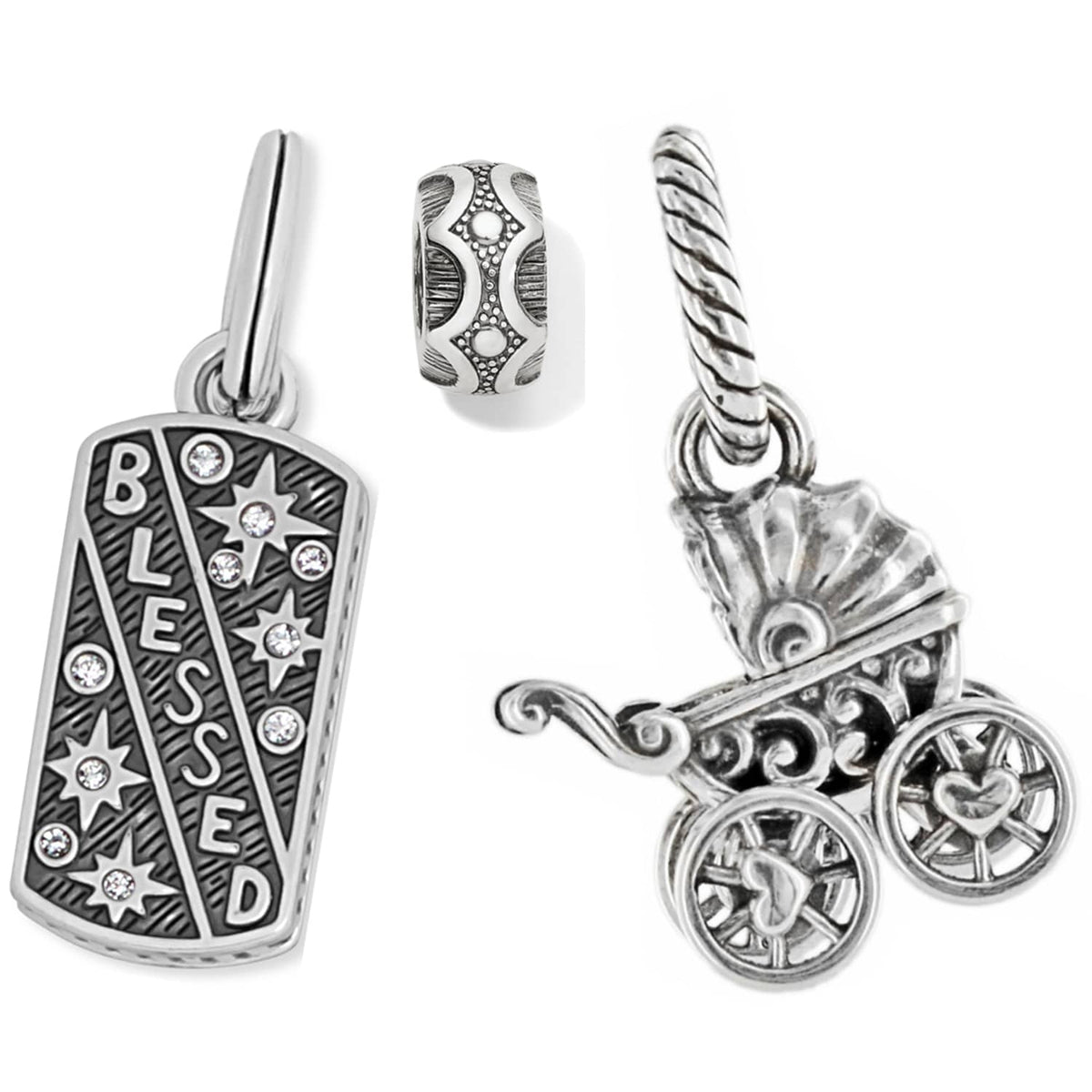 Brighton silver-plated charms featuring a Blessed tag with crystals, patterned spacer bead, and ornate baby carriage on a white background