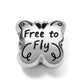 Brighton silver-plated butterfly charm engraved with Free to Fly text and decorative scroll details on a white background
