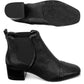 Brighton black leather ankle boots with block heel, elastic side panels, and patterned sole on a white background
