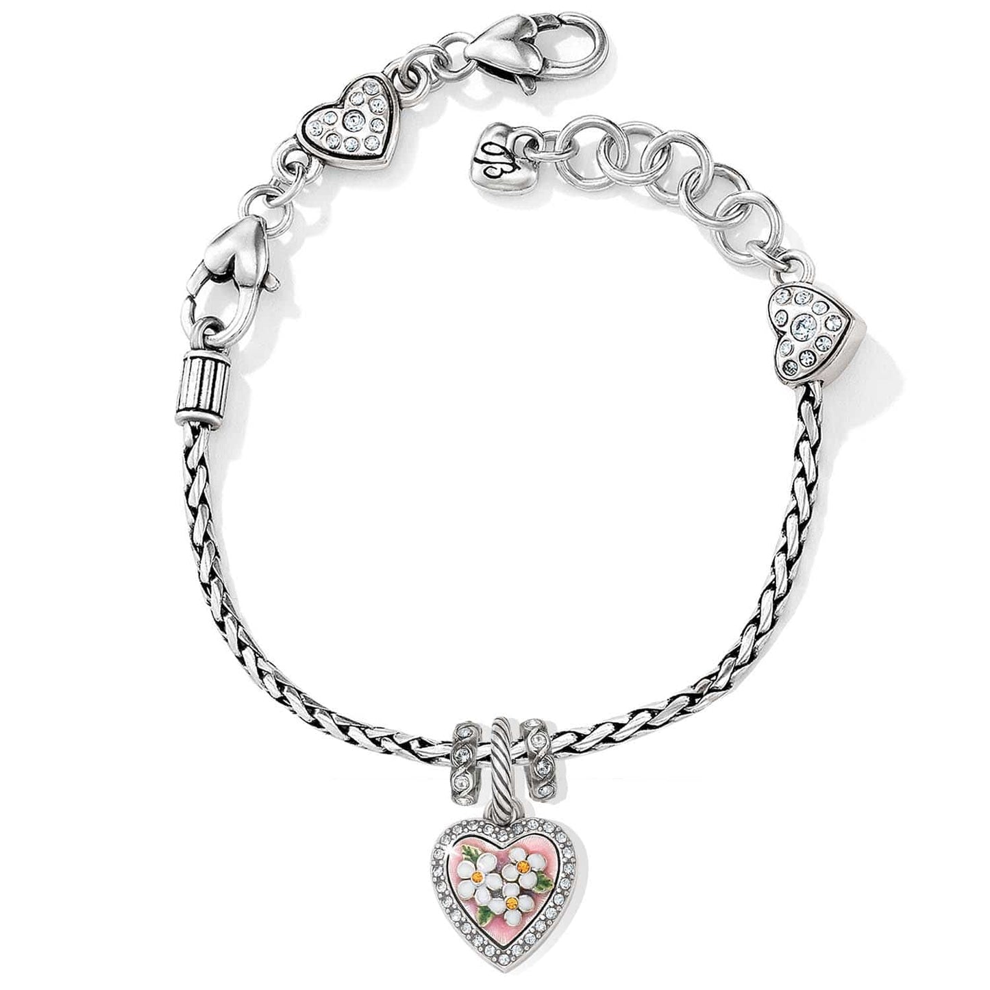 Brighton charm bracelet with silver-plated braided chain, crystal heart charms, and pink floral enamel heart pendant on a white background