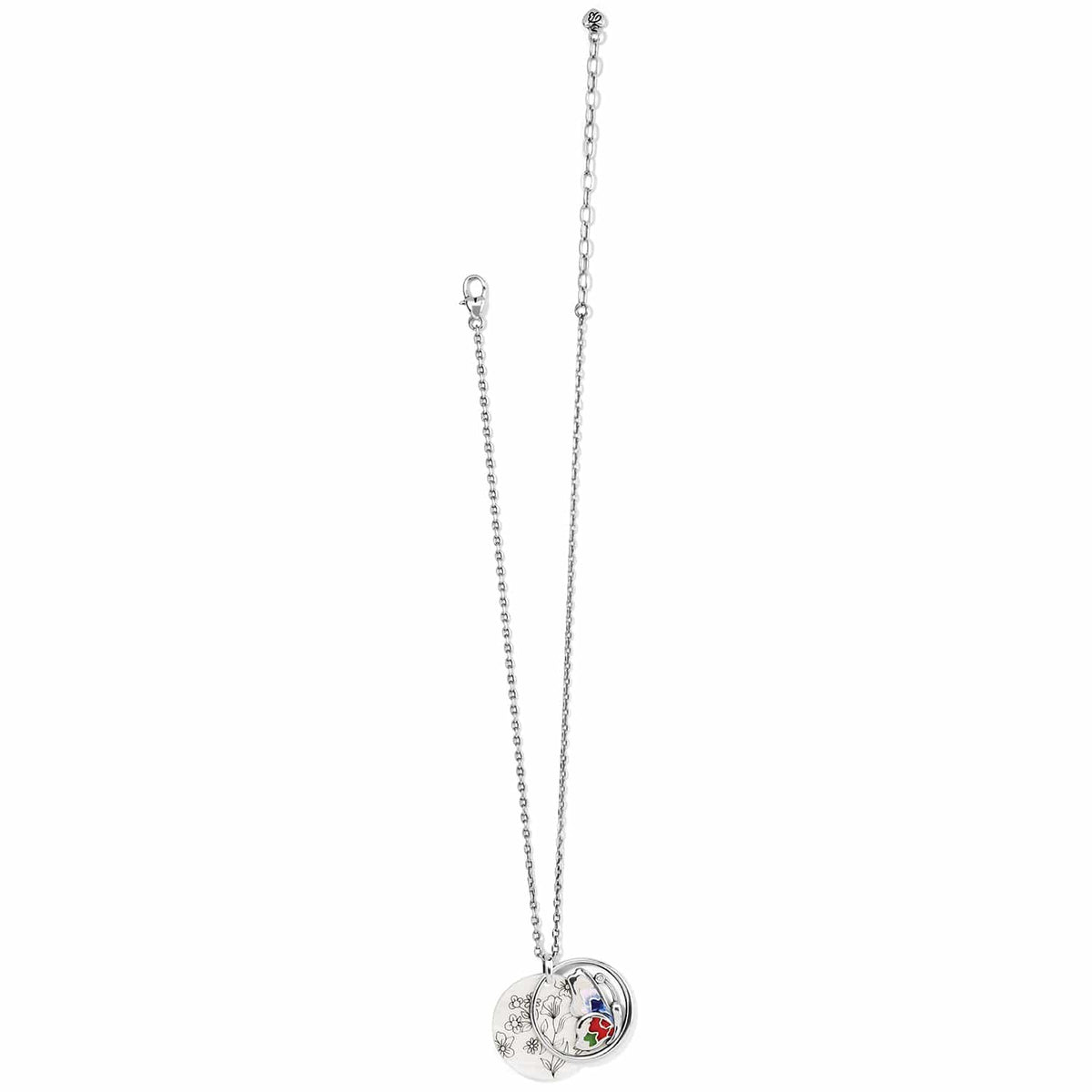 Brighton silver-plated pendant necklace with floral engraved disc and enamel charm with crystal accents on a white background