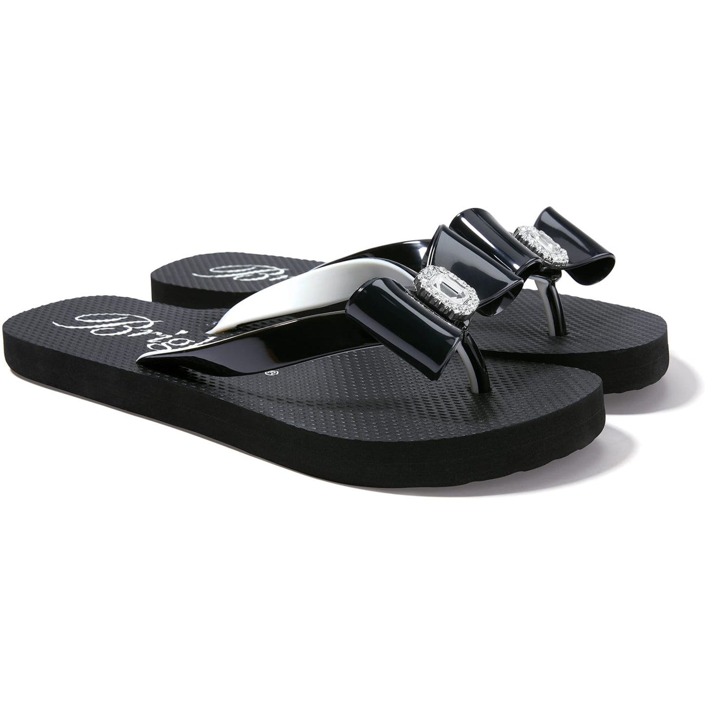 Brighton black rubber flip-flop sandals with glossy bow straps and crystal-accented centerpieces on a white background