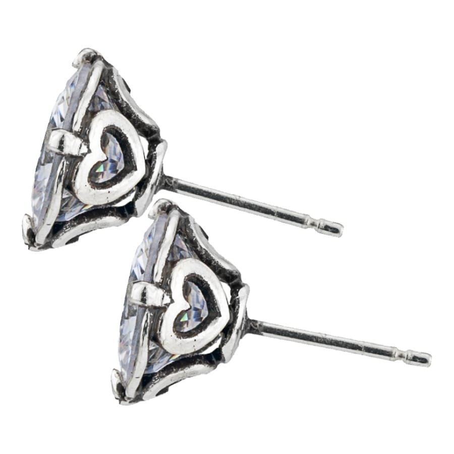 Brighton stud earrings with faceted crystal centers and silver-plated heart accents with posts on a white background