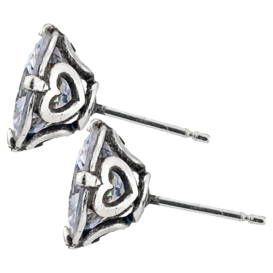 Brighton stud earrings with large crystal centers, silver-plated heart accents, and post backs on a white background
