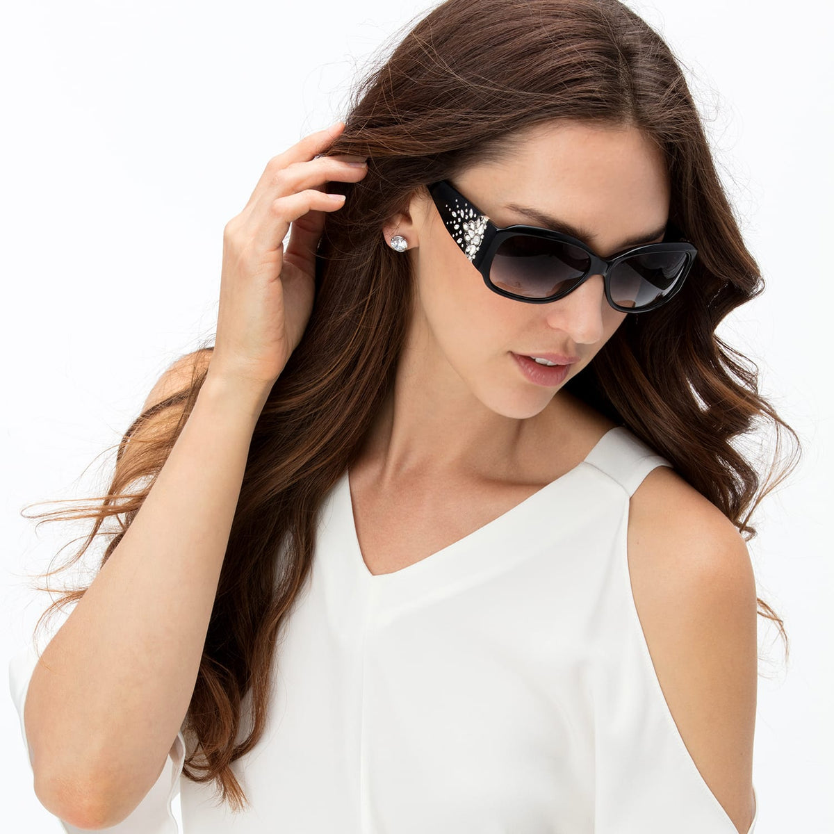 Model wearing Brighton black cat-eye sunglasses with crystal embellishments on the temples and gradient lenses