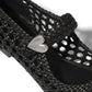 Close-up of Brighton woven black leather shoe with silver-tone heart accent on braided strap