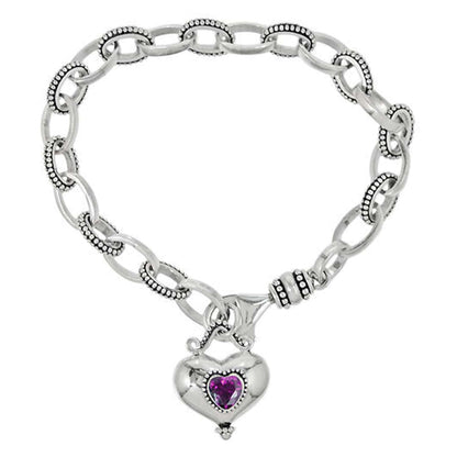 Brighton chain link bracelet with sterling silver beaded links and heart charm with purple crystal on a white background