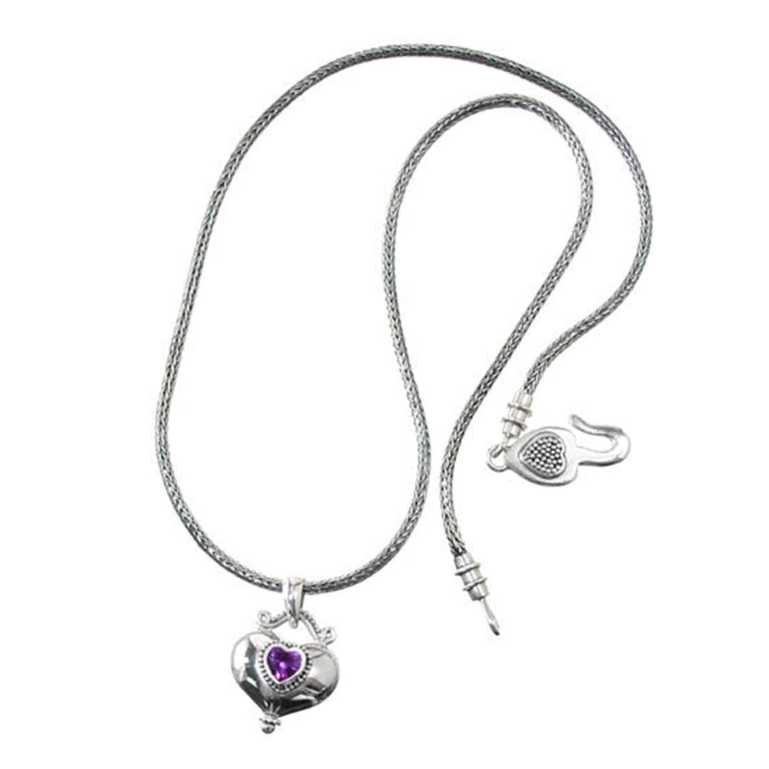 Brighton necklace in sterling silver with woven chain, heart pendant featuring purple crystal, and hook clasp on a white background