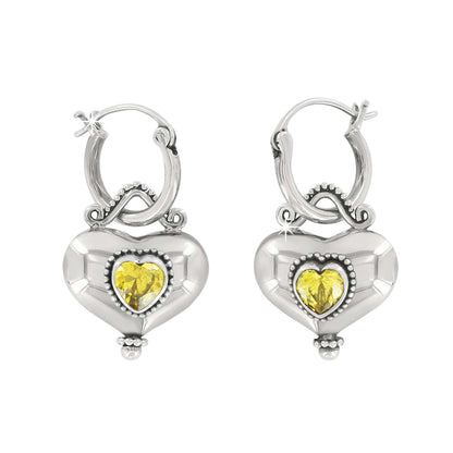 Brighton hoop earrings with sterling silver heart drops and yellow crystal centers with beaded detail on a white background