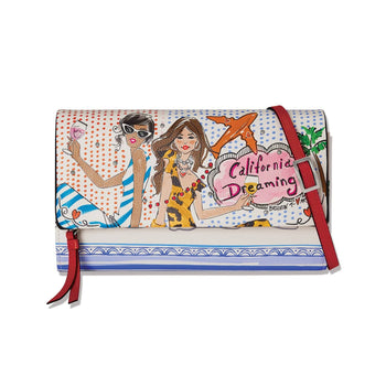 Brighton wallet with illustrated California Dreaming print of two women, polka dots, and red leather strap on a white background