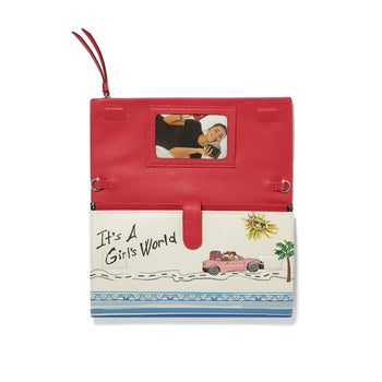 Brighton wallet shown open with red interior, photo window, and illustrated It's A Girl's World print on white background
