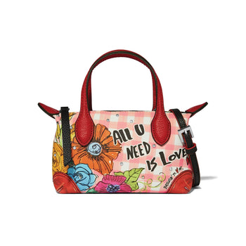 Brighton handbag with floral print and All U Need Is Love graphic, red leather handles on a white background