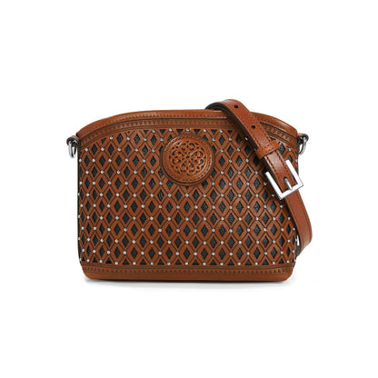 Brighton crossbody handbag in tan leather with diamond cutout pattern, silver-tone studs, and adjustable strap on a white background