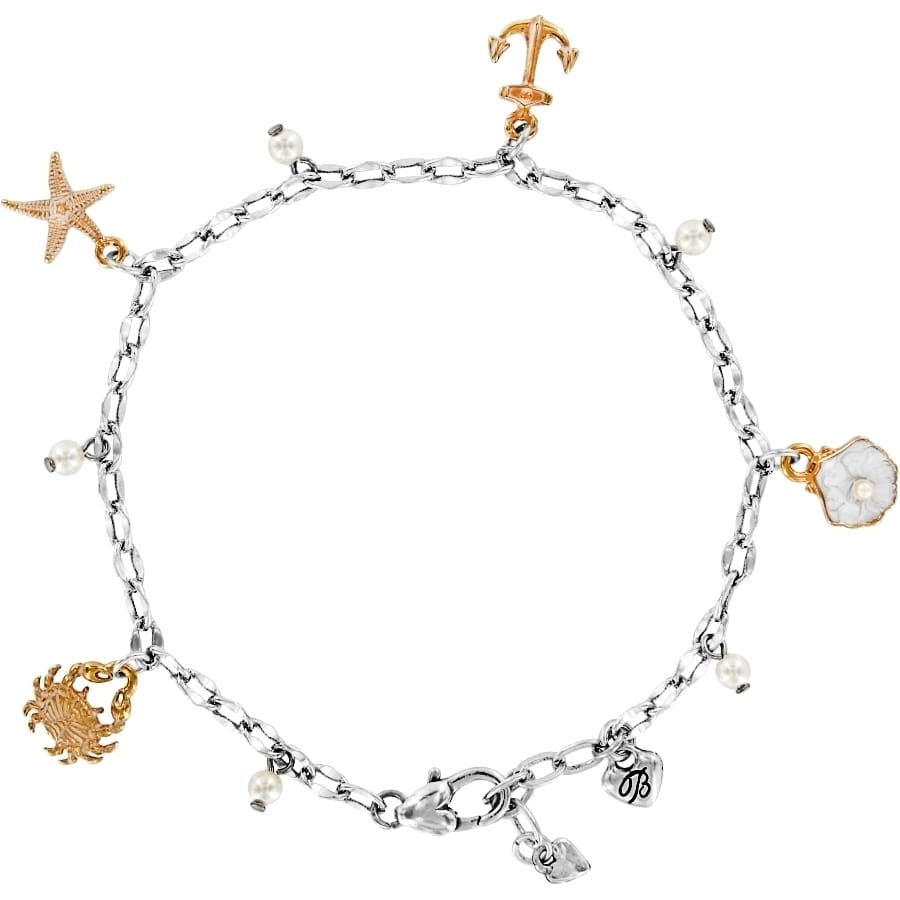 Brighton charm bracelet with silver-plated chain, brushed gold starfish, anchor, crab charms, and glass pearls on a white background