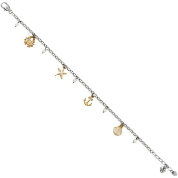 Brighton charm bracelet with silver-plated chain, brushed gold sea charms, and glass pearl accents on a white background