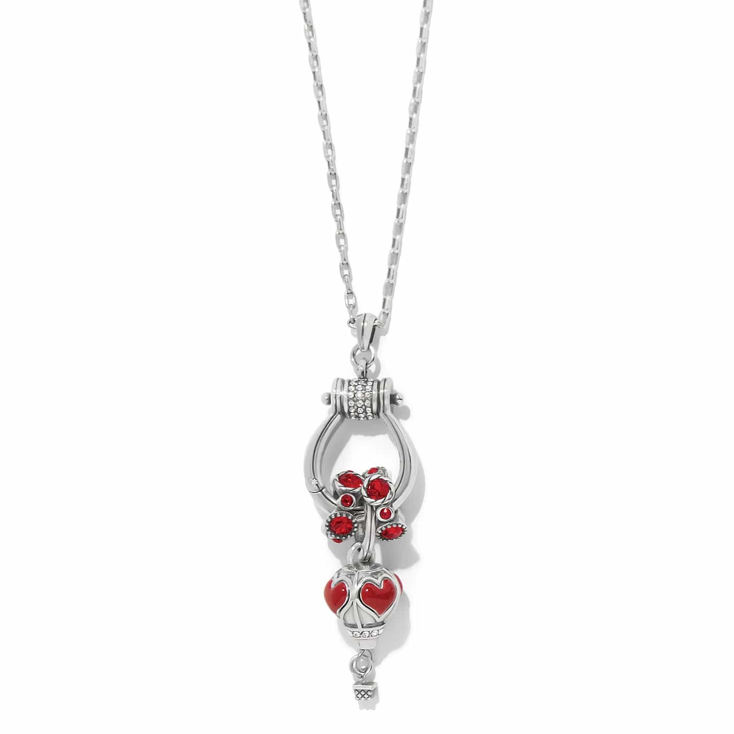 Brighton pendant necklace with silver-plated horseshoe, red crystal flowers, heart charm, and crystal accents on a white background