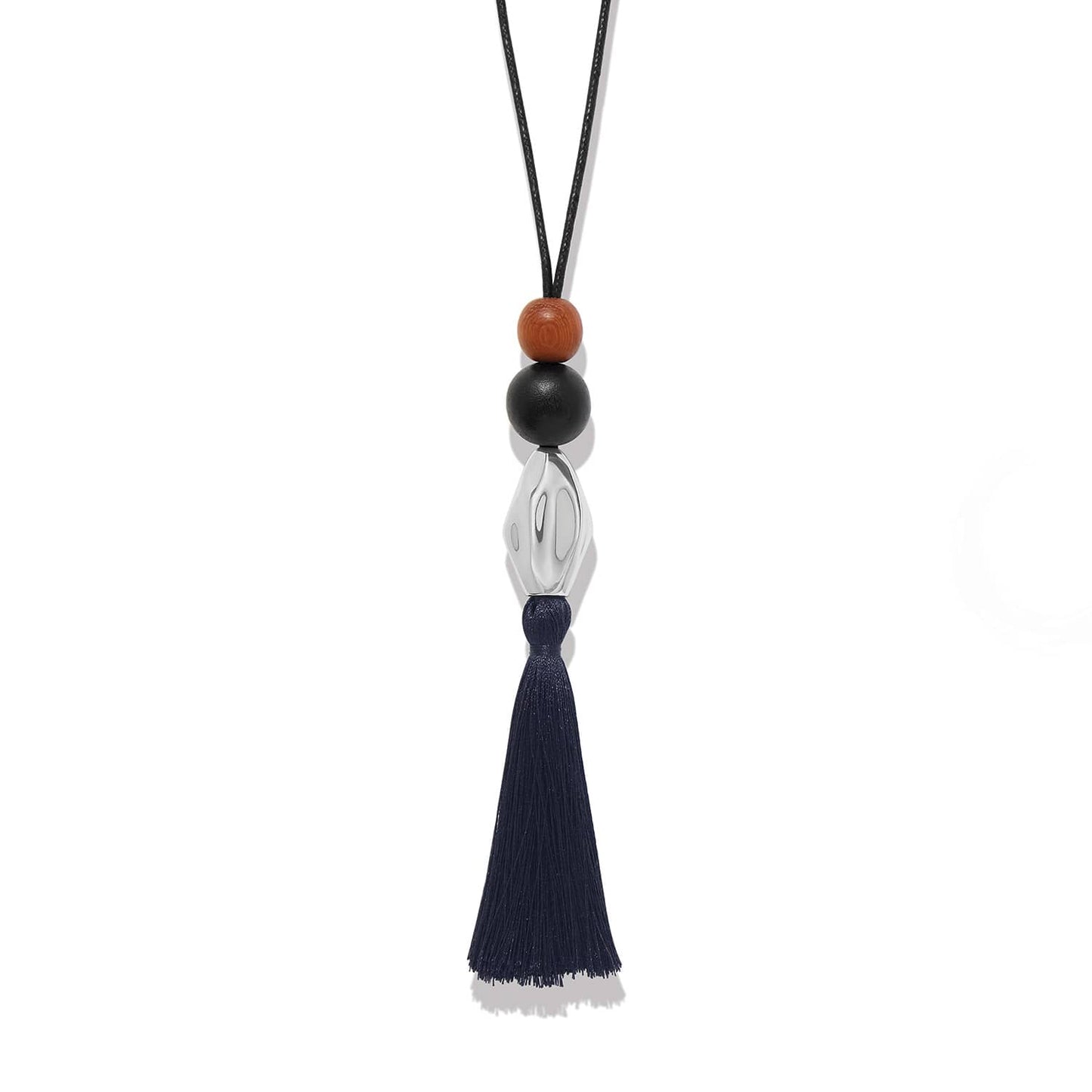 Brighton tassel pendant necklace with wood beads, silver-plated accent, and navy tassel on black cord on a white background