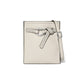 Brighton crossbody handbag in cream pebbled leather with studded knot strap and silver-tone buckle on a white background
