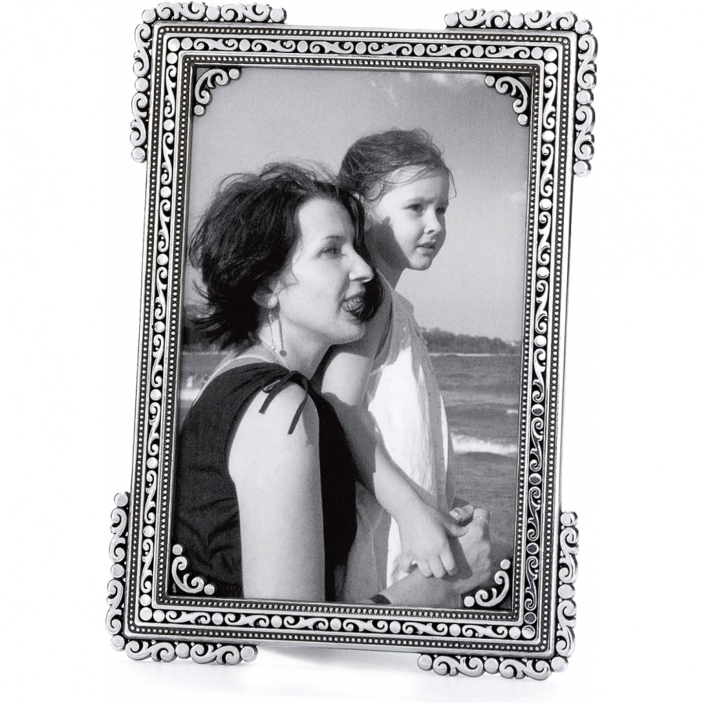 Brighton picture frame with silver-plated ornate scroll and beaded border holding a black and white photo on a white background