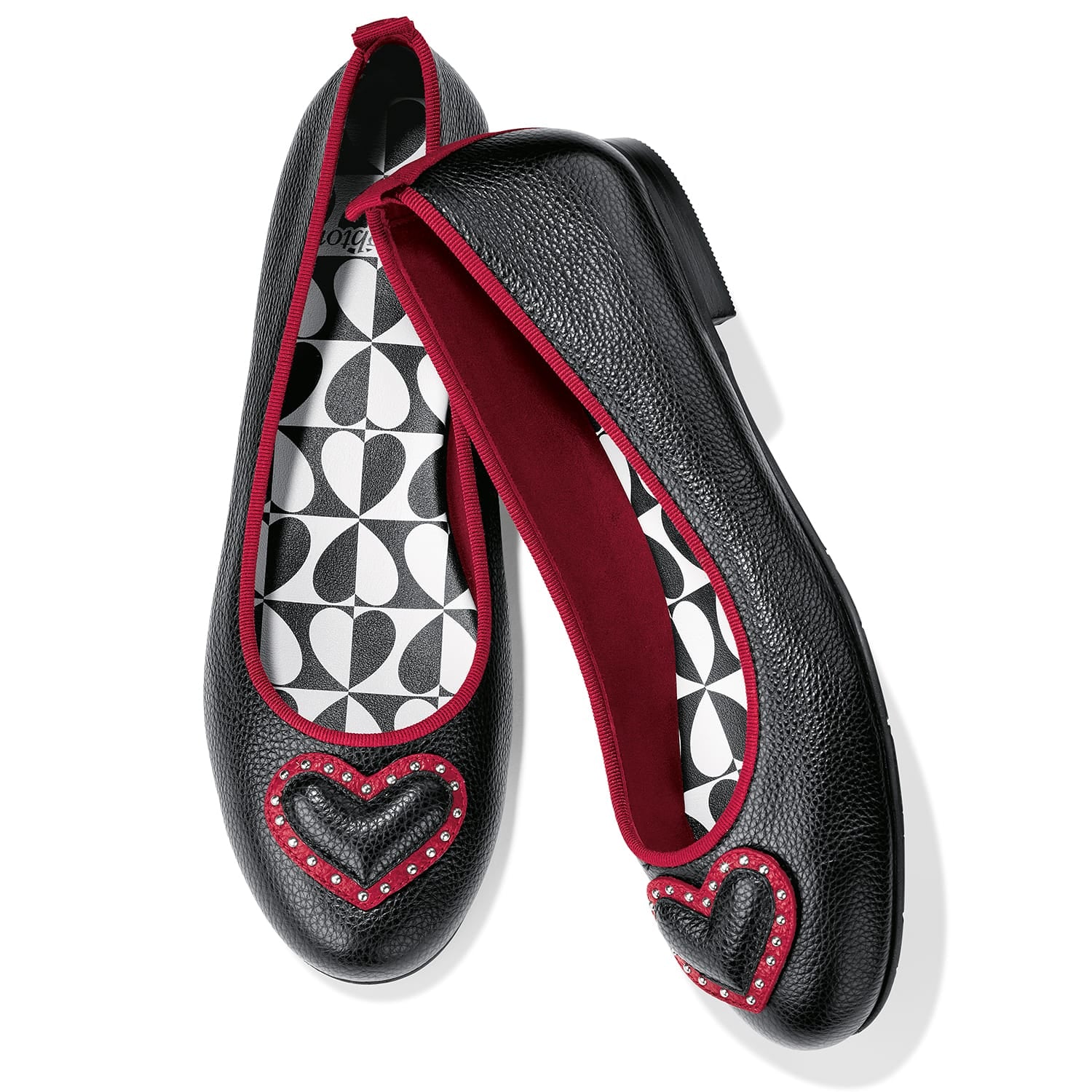 Brighton black leather ballet flats with red trim, heart appliqués, crystal accents, and geometric printed lining on a white background